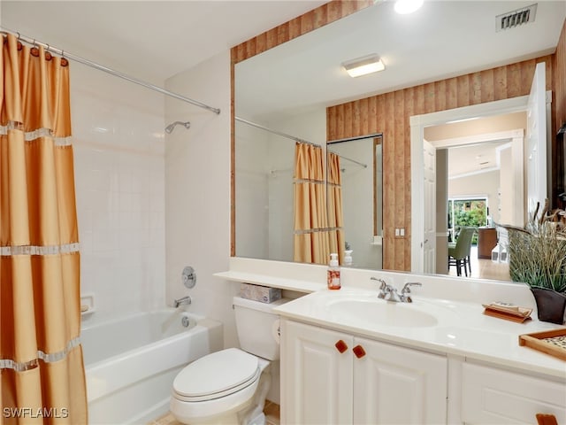 full bathroom with toilet, vanity, shower / bath combination with curtain, and visible vents