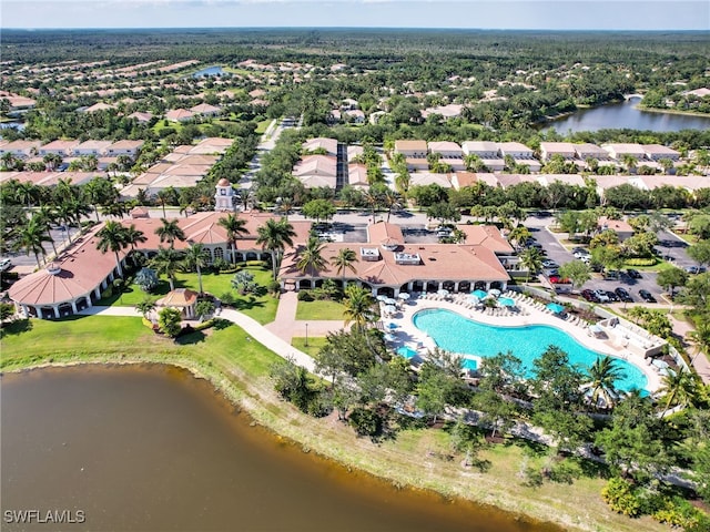 drone / aerial view featuring a water view and a residential view