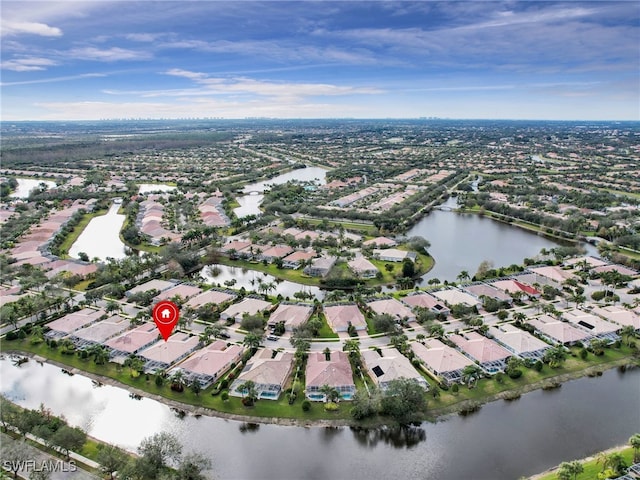 bird's eye view with a water view and a residential view