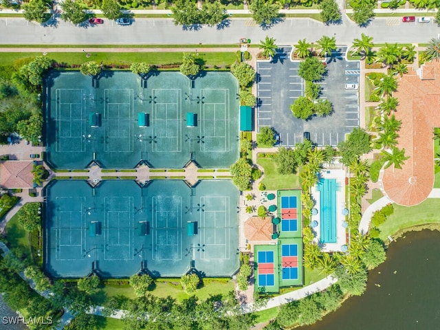 birds eye view of property with a water view