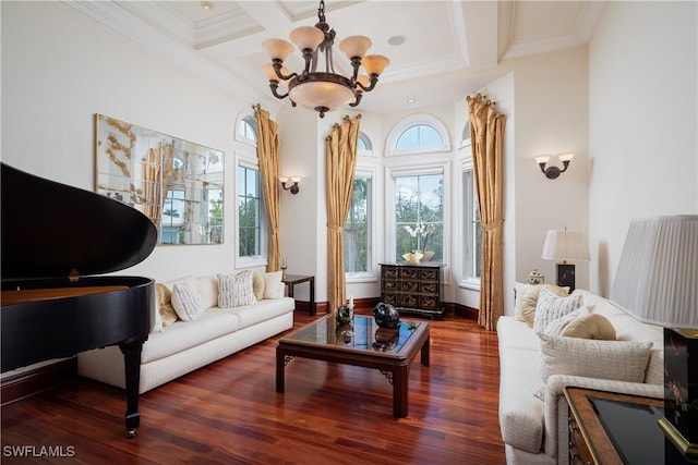 sitting room with dark hardwood / wood-style floors, ornamental molding, a chandelier, beam ceiling, and coffered ceiling