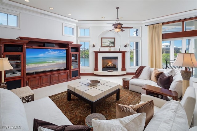 living room featuring ceiling fan and ornamental molding