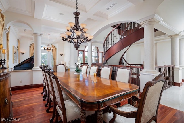 dining space with an inviting chandelier, a healthy amount of sunlight, beam ceiling, and coffered ceiling