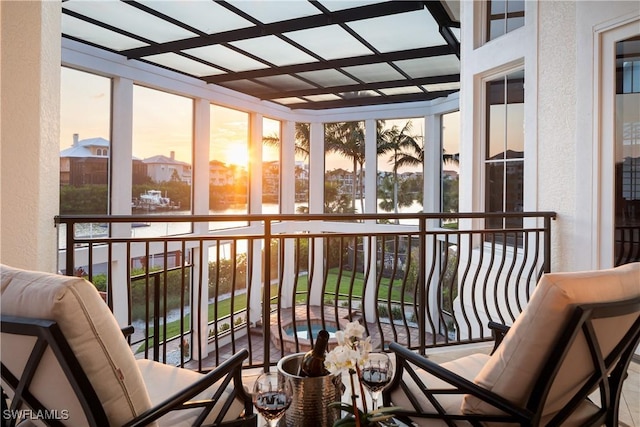 sunroom with a water view