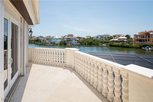 balcony featuring a water view