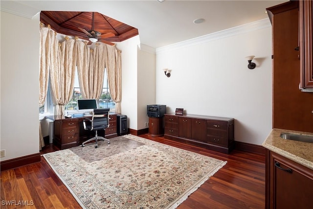 office area featuring ceiling fan, dark hardwood / wood-style flooring, crown molding, and sink