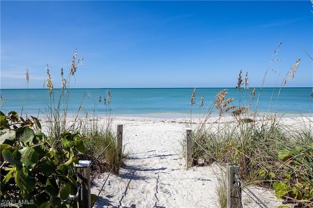 view of water feature with a beach view