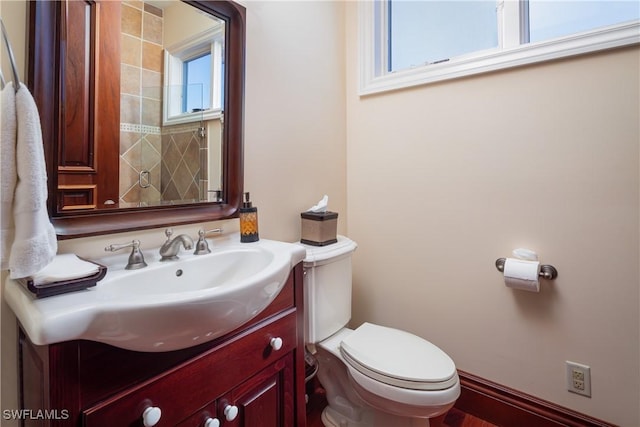 bathroom featuring toilet and vanity