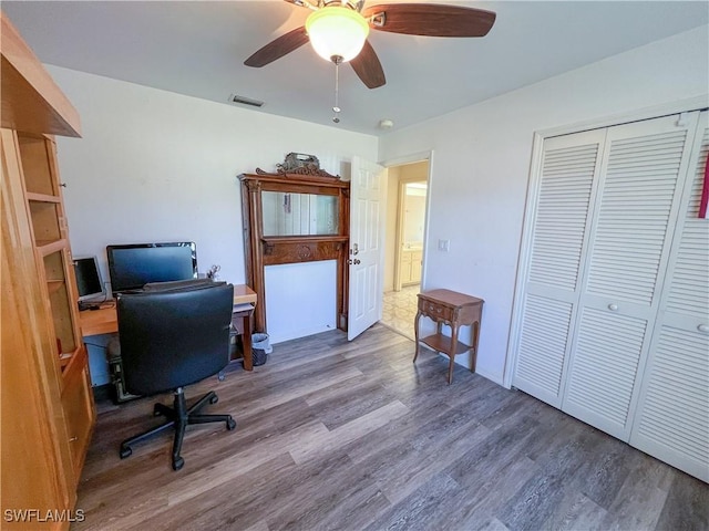 home office featuring hardwood / wood-style flooring and ceiling fan