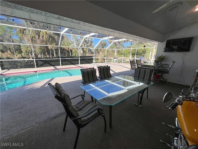 view of pool with a patio and a lanai