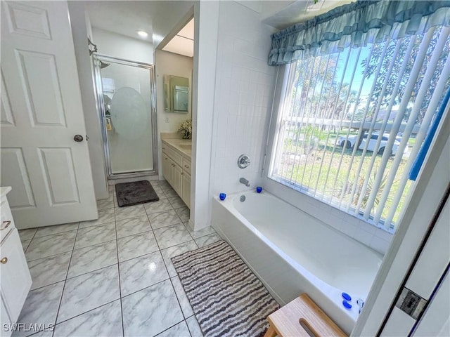 bathroom with plus walk in shower, vanity, and tile patterned flooring