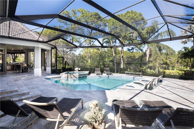 view of pool with a patio and a pool with connected hot tub