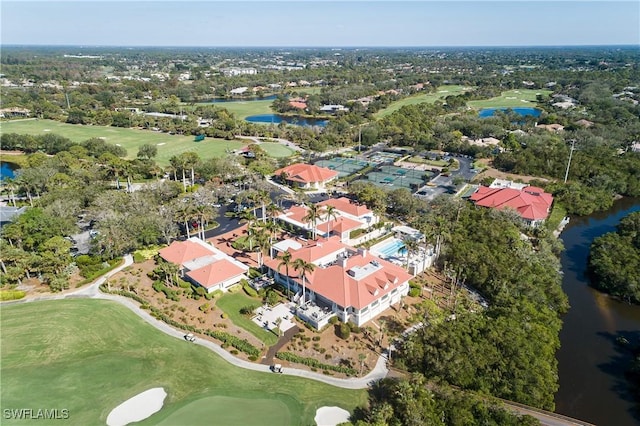 birds eye view of property with a water view and view of golf course