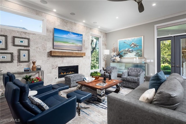 living room with recessed lighting, a fireplace, crown molding, and a ceiling fan