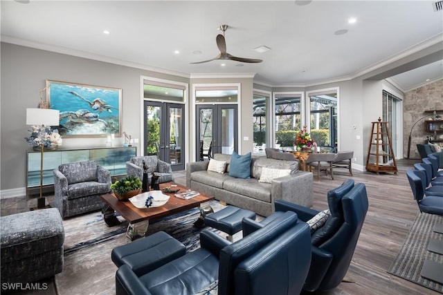 living area with french doors, baseboards, and a healthy amount of sunlight