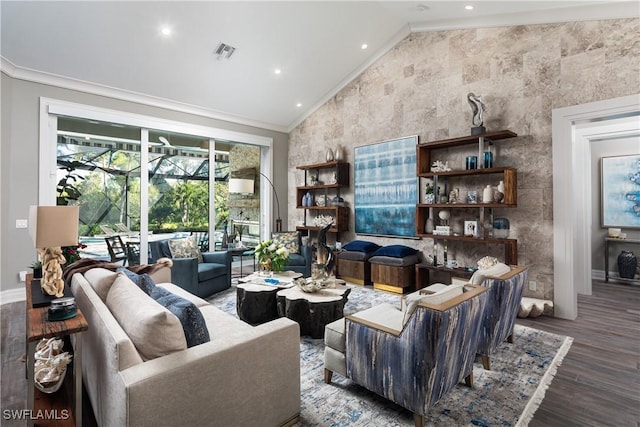 living room with visible vents, wood finished floors, baseboards, crown molding, and lofted ceiling