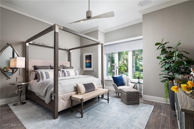 bedroom with visible vents, baseboards, dark wood finished floors, ceiling fan, and crown molding