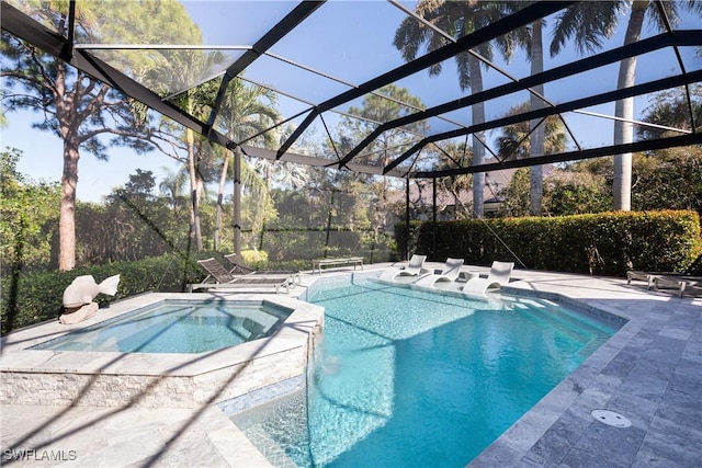 pool with glass enclosure, an in ground hot tub, and a patio area