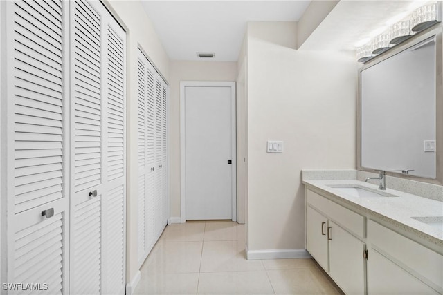 bathroom featuring tile patterned floors and vanity