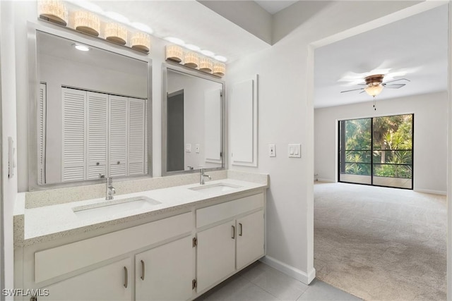 bathroom featuring tile patterned floors, vanity, and ceiling fan