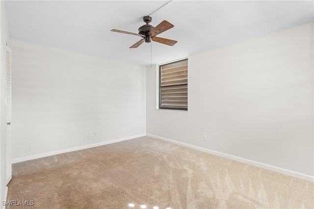 carpeted empty room with ceiling fan