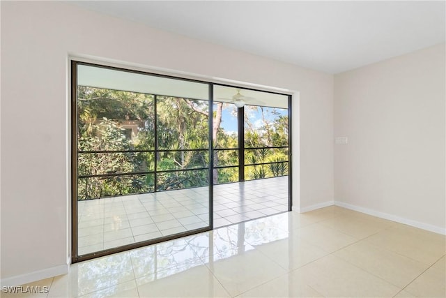 unfurnished room featuring light tile patterned floors