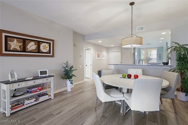 dining area with wood-type flooring