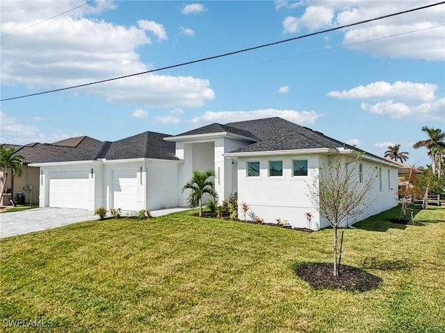 view of front of home featuring a garage and a front yard