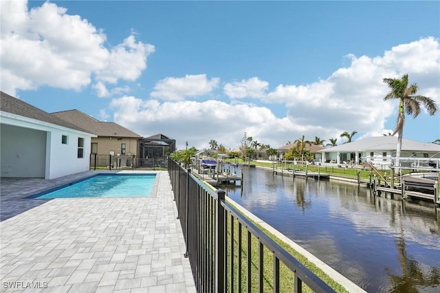 view of swimming pool featuring a water view and a dock