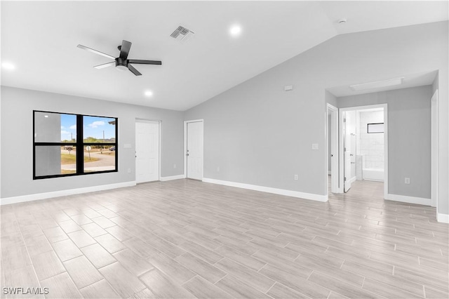 spare room featuring ceiling fan and vaulted ceiling