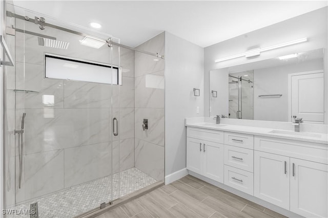 bathroom with vanity and walk in shower