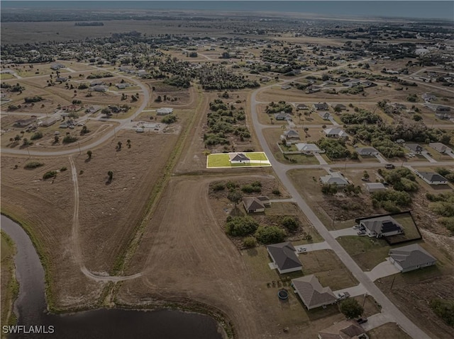 birds eye view of property featuring a rural view