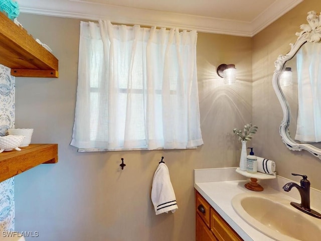 bathroom with vanity and ornamental molding