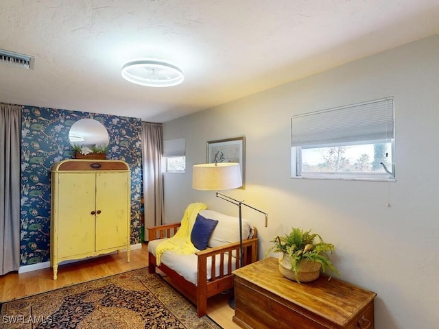 sitting room featuring hardwood / wood-style flooring and a wealth of natural light