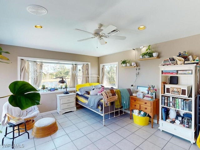 tiled bedroom featuring ceiling fan