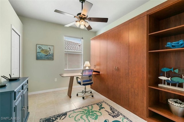 tiled office space with ceiling fan