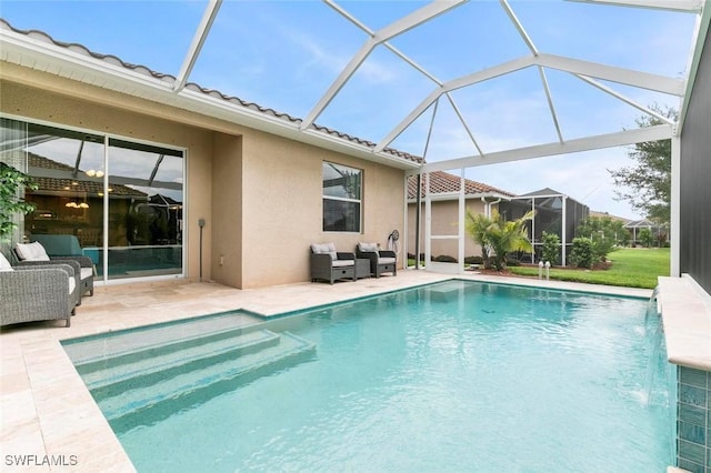 view of swimming pool featuring pool water feature and a patio