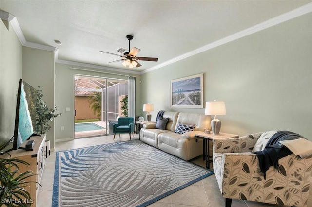 living room with ceiling fan, light tile patterned floors, and crown molding