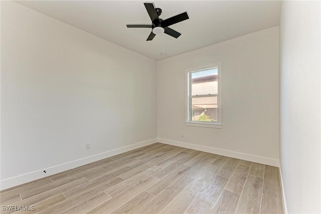 unfurnished room with ceiling fan and light wood-type flooring