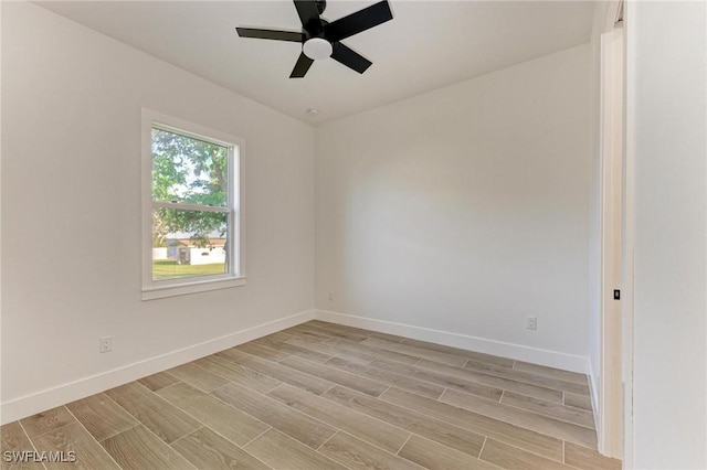 unfurnished room with ceiling fan and light hardwood / wood-style floors