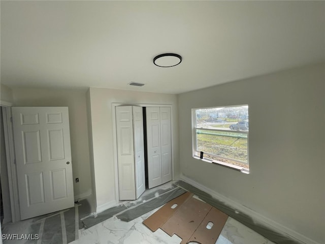 unfurnished bedroom featuring a closet