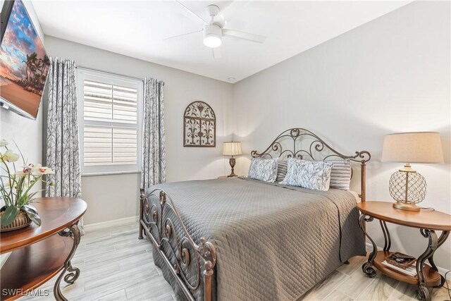 bedroom featuring ceiling fan and light hardwood / wood-style floors