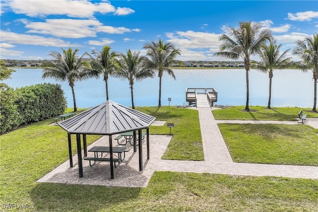 surrounding community featuring a water view, a gazebo, a lawn, and a dock