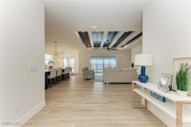 living room with plenty of natural light and ceiling fan