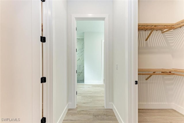 hall with light hardwood / wood-style floors