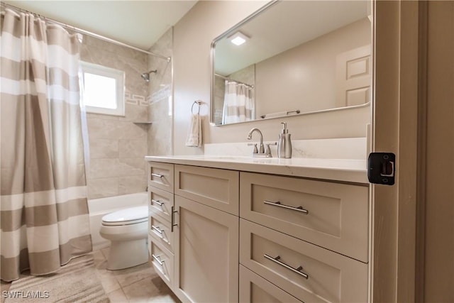 full bathroom featuring toilet, shower / bath combo with shower curtain, and vanity