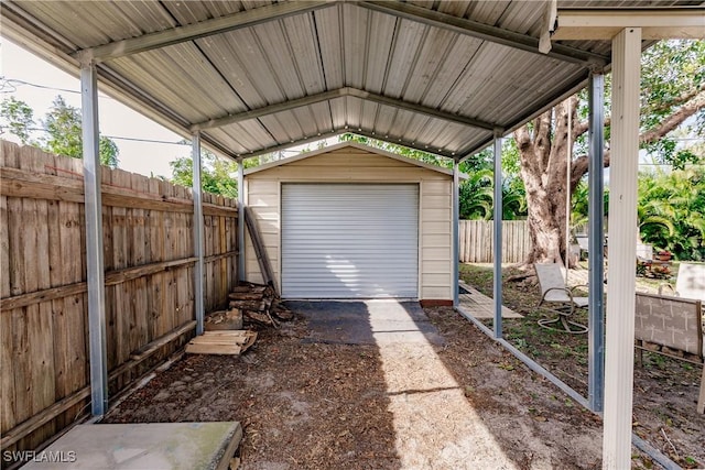 garage featuring a carport