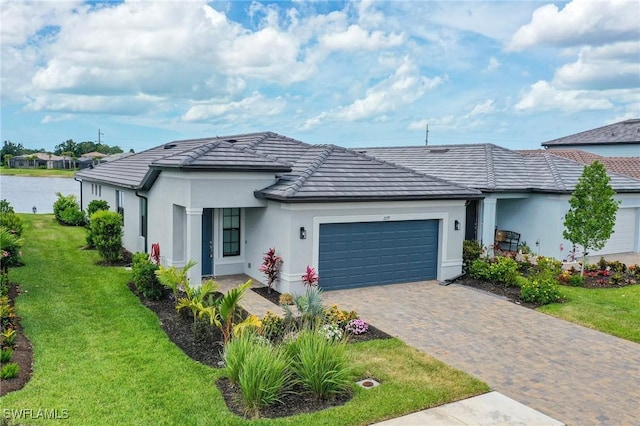 single story home featuring a front lawn and a garage