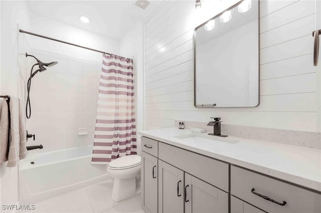 full bathroom featuring tile patterned floors, vanity, toilet, and shower / bathtub combination with curtain