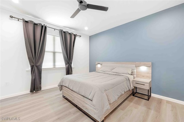 bedroom featuring light wood-type flooring and ceiling fan